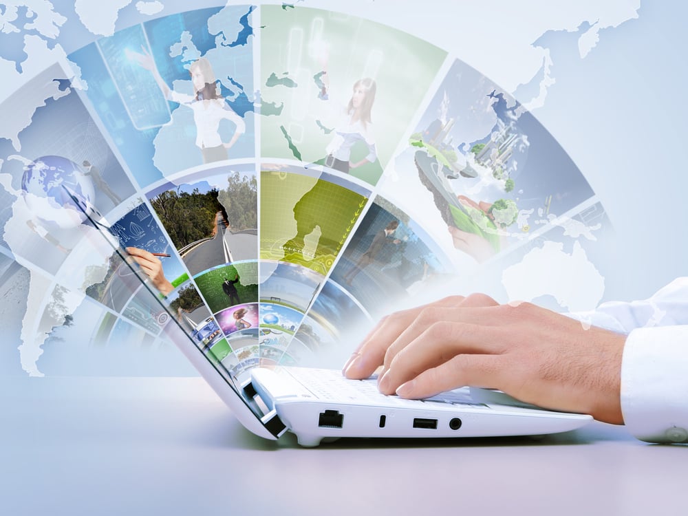Featured image: hands typing on a laptop - the image above the screen reflects a variety of images to represent ideas. - Read full post: Navigating the Shift: How Data Unlocks Growth in Changing Markets