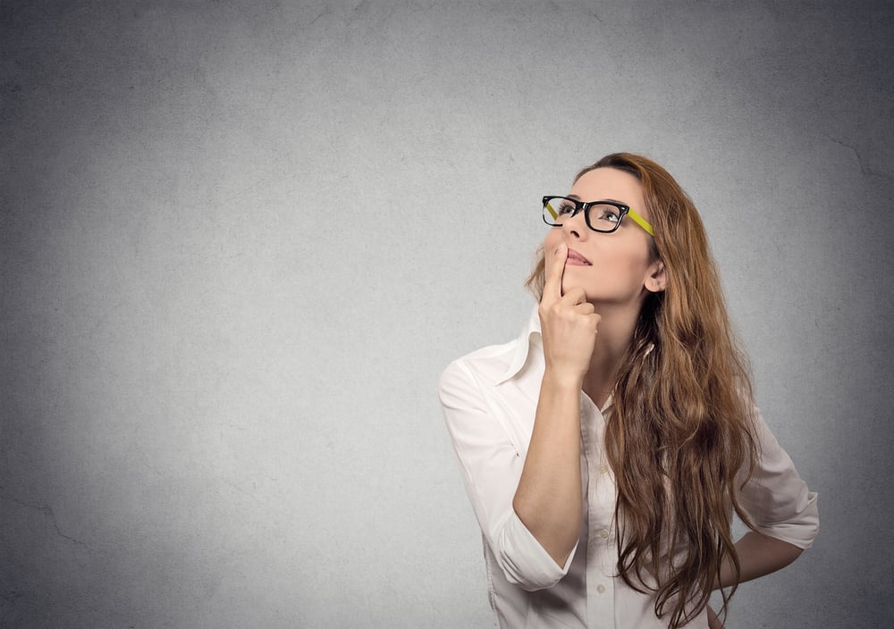 Featured image: a young professional woman with long hair and glasses looking pensively - Read full post: Making Every Dollar Count (or Talk, if You’re Qualitatively Inclined): Maximizing the Impact of Your End-of-Year Research Dollars